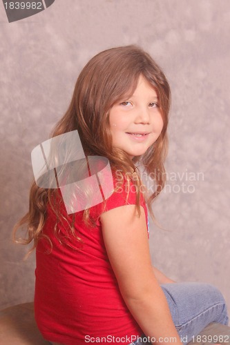 Image of Pretty little girl in red shirt