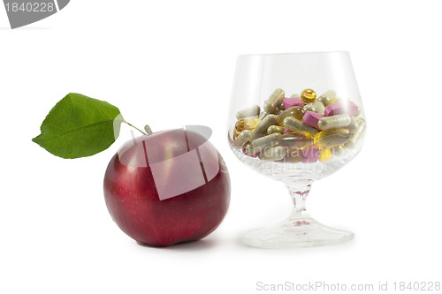 Image of apple and pills