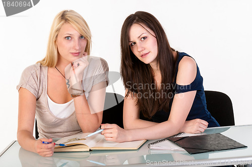 Image of Two beautiful student girls getting ready for school