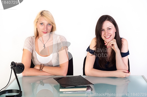 Image of Two beautiful student girls getting ready for school