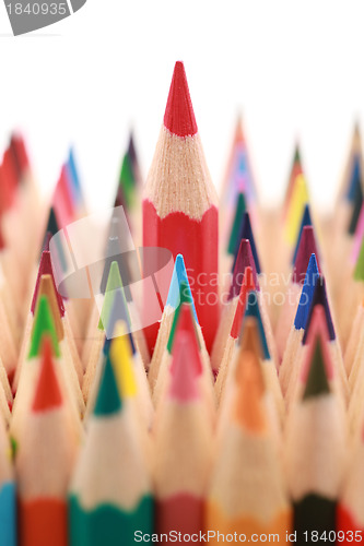 Image of Red crayon standing out from the crowd