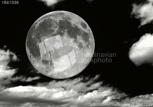 Image of full moon in clouds