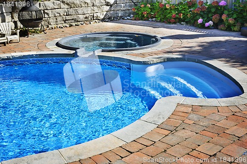 Image of Swimming pool with hot tub