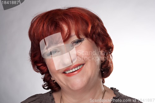 Image of Portrait of a smiling senior woman.