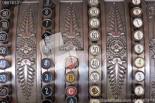 Image of Antique store silver cash register buttons