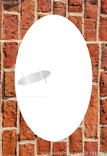 Image of Old clay brick wall and white oval in center 