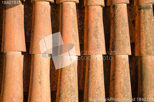 Image of Background of clay round tiles cover roof closeup 