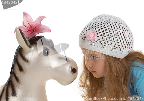 Image of adorable little girl with toy