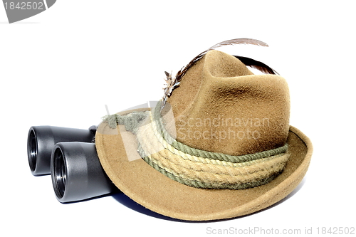 Image of binoculars covered by hat