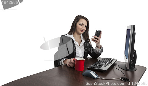 Image of Businesswoman Checking Her Mobile