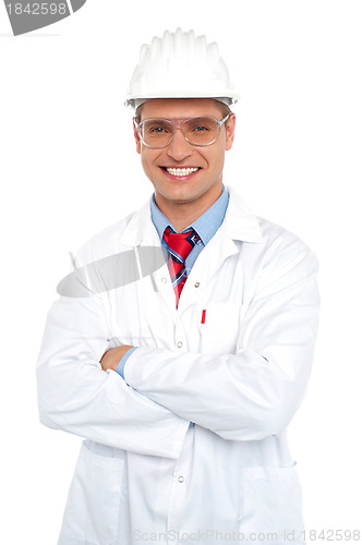 Image of Male architect wearing safety glasses and hard hat