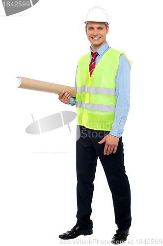 Image of Smiling young architect holding blueprints