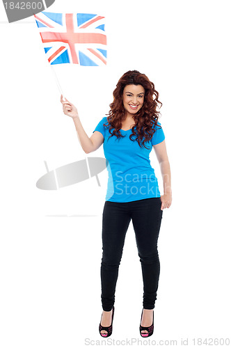 Image of UK female supporter posing with flag