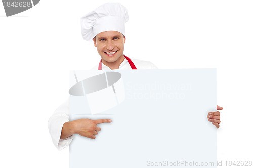 Image of Chef pointing at the blank white billboard