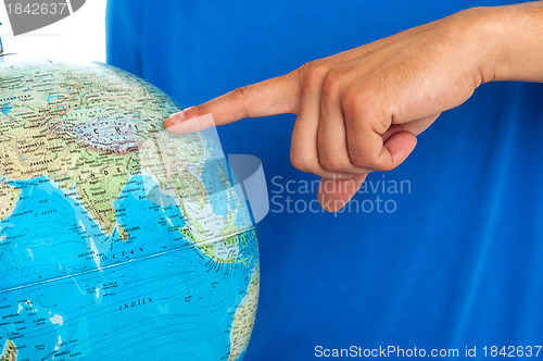 Image of Closeup shot of male finger pointing at China