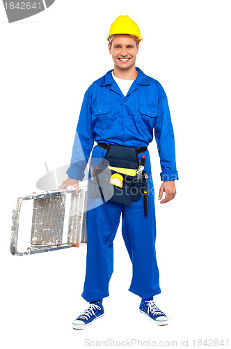 Image of Construction worker ready with stepladder
