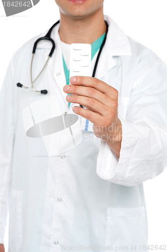 Image of Cropped image of physician displaying medicine pack