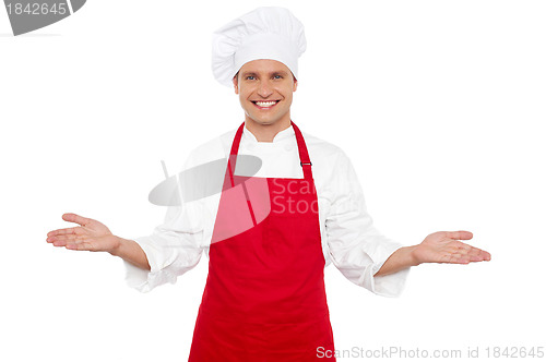 Image of Joyful chef welcoming his guests