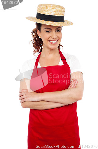 Image of Young baker woman wearing straw bowler hat