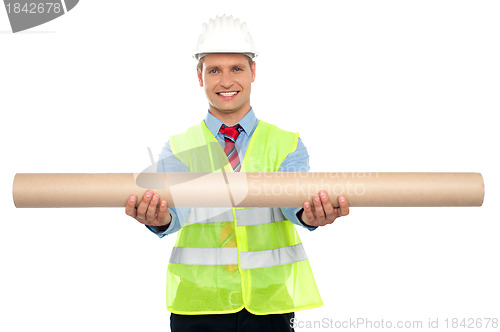 Image of Successful architect presenting blueprints