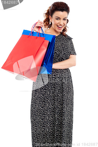 Image of Profile shot of woman holding shopping bags