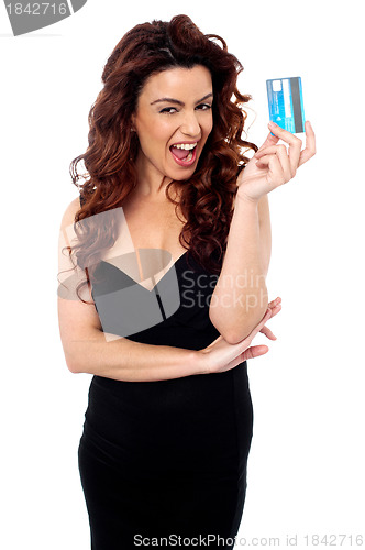 Image of Fashionable woman holding cash card