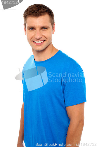 Image of Cheerful casual man smiling at camera