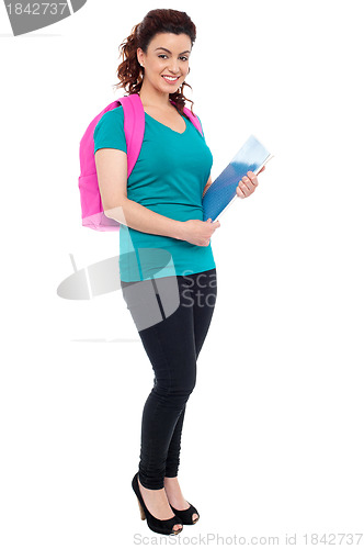 Image of Student with backpack and spiral notebook