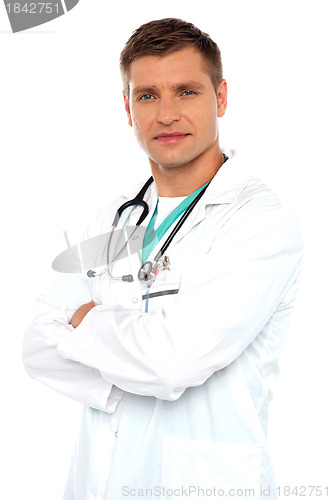 Image of Handsome young doctor posing with crossed arms