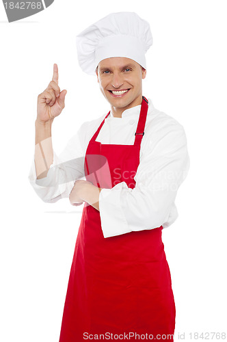 Image of Happy smiling chef showing index finger