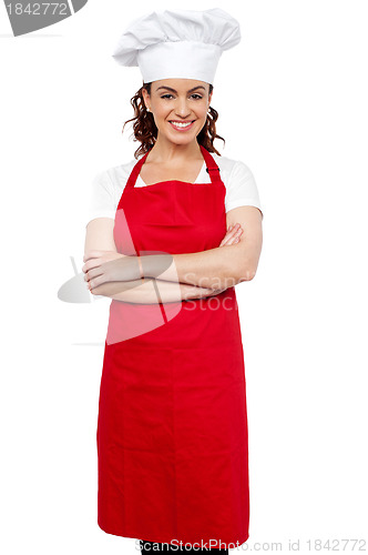 Image of Female chef standing with her arms crossed