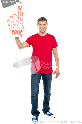 Image of Casual guy showing large pointy boo hurray hand