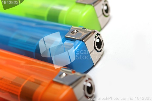 Image of three colorful lighters