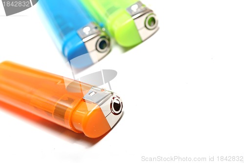 Image of three colorful lighters