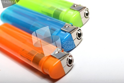 Image of three colorful lighters