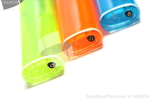 Image of three colorful lighters