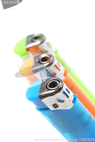 Image of three colorful lighters