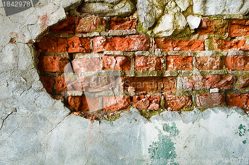 Image of The destruction of a brick wall