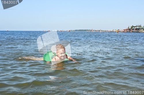 Image of Little girl swimming