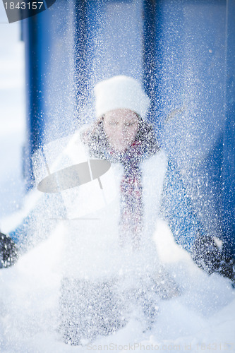 Image of Woman throwing snow