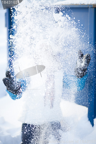 Image of Woman throwing snow