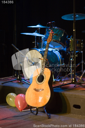 Image of Guitar and Drums on Stage