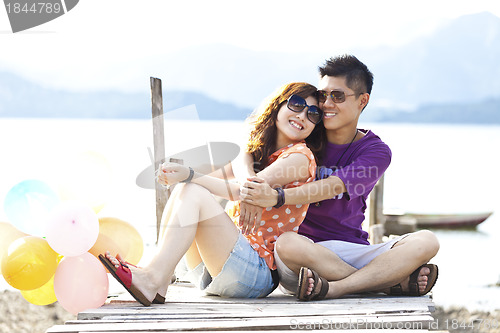 Image of Asian couple smiling