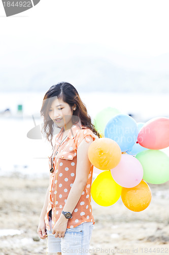 Image of Asian woman with balloon
