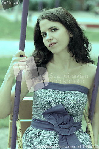 Image of Lady on the swing