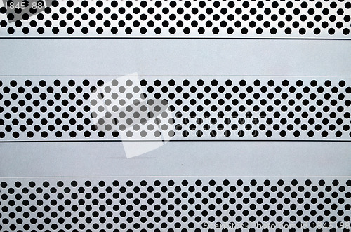 Image of Background small round holes on computer pack box 