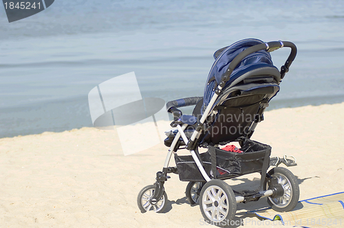 Image of Kids carriage on a seashore