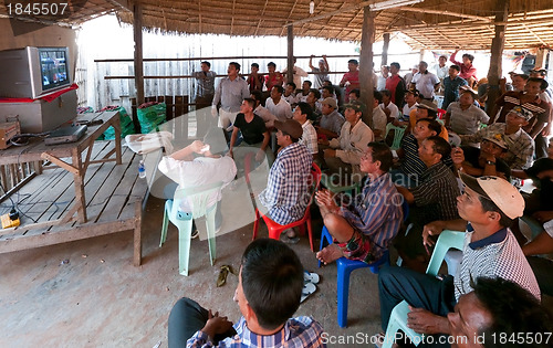 Image of Villagers watching TV in Cambodia