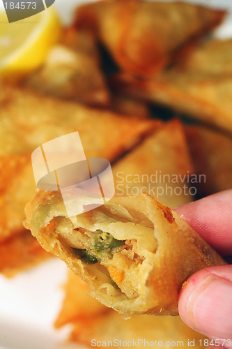 Image of Eating a samosa