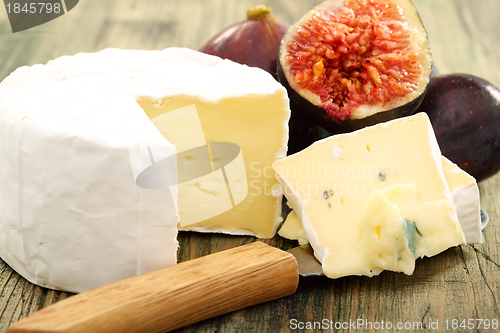 Image of Cheese and fresh figs closeup.